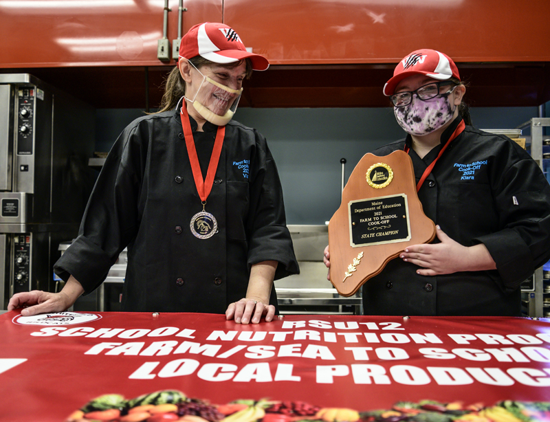 Whitefield Elementary School head cook Vicki Dill and eighth grader Kiara Luce show off their state championship plaque in Whitefield on Friday, May 7. (Bisi Cameron Yee photo)