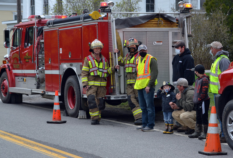 Firefighters wait for Bristol Fire Chief Paul Leeman Jr. to arrive in Round Pond on Friday, April 30. (Maia Zewert photo)