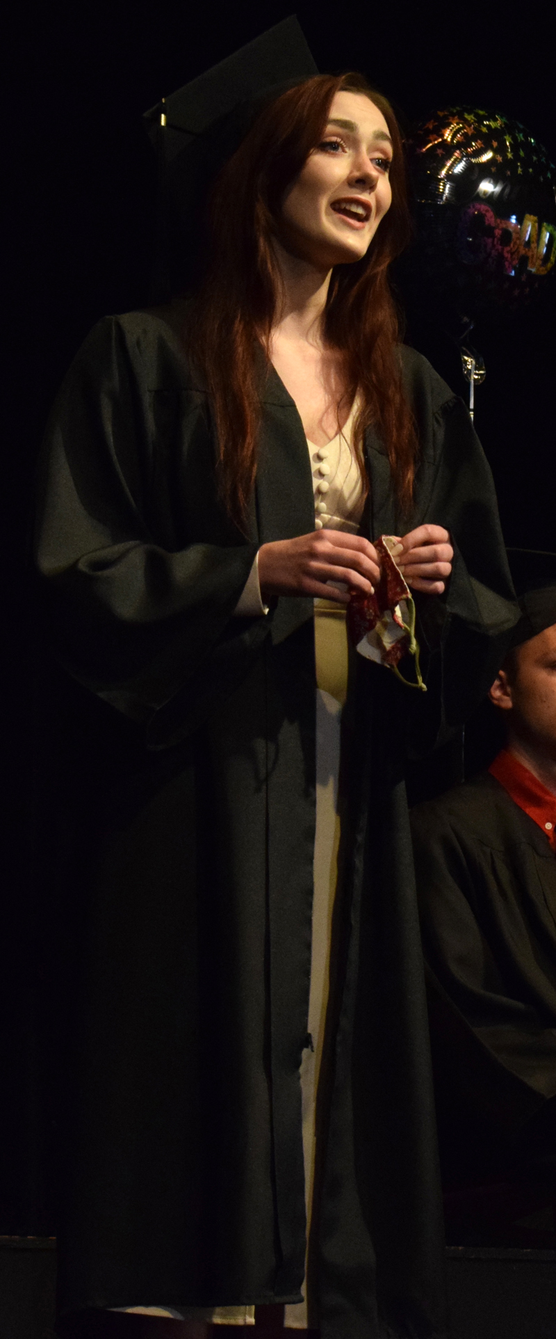 Central Lincoln County Adult Education graduate Honora Boothby sings Meadowlark from the musical The Bakers Wife during a ceremony at the Lincoln Theater on Tuesday, June 8. (Evan Houk photo)