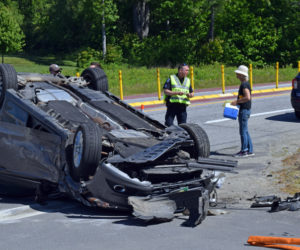 Sgt. Erick Halpin, of the Damariscotta Police Department, works the scene of a three-car collision at the intersection of Route 1 and Belvedere Road in Damariscotta the morning of Wednesday, June 2. (Evan Houk photo)