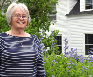 Donna Brooks stands in front of her nearly 250-year-old farmhouse in Jefferson on Friday, June 11. Brooks has served in the Lions Club International for 33 years and received one of the organization's highest honors, the Melvin Jones Fellowship award. (Evan Houk photo)