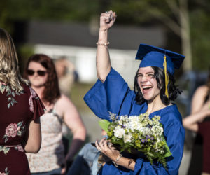 Brooke Fillmore pumps her fist in celebration after the RSU 40 Adult Education graduation ceremony at Medomak Valley High School in Waldoboro on Thursday, June 10. (Bisi Cameron Yee photo)