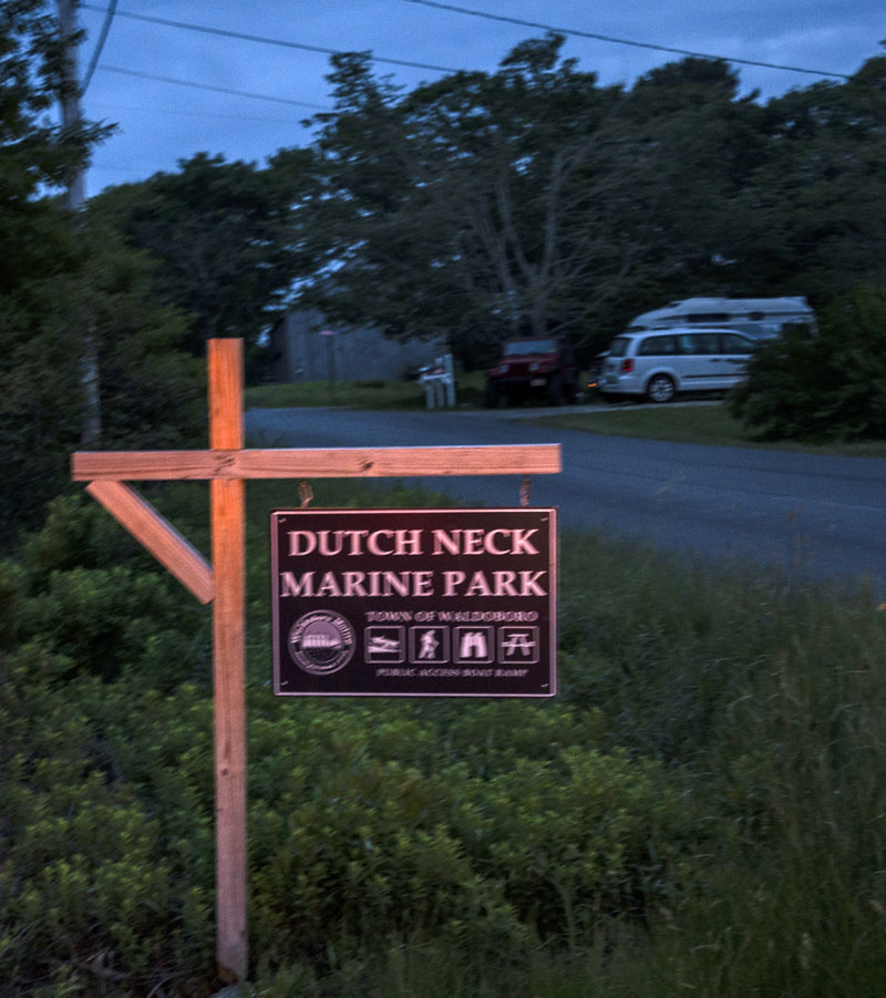 Headlights catch the sign for the Dutch Neck Marine Park in Waldoboro on Tuesday, June 8. The park was the staging area for an overnight search for a missing fisherman from Monday, June 7 into Tuesday, June 8, when searchers found his body. (Bisi Cameron Yee photo)