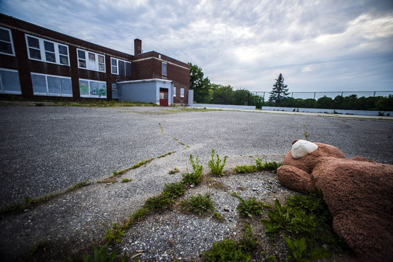 An abandoned teddy bear lay in the parking lot behind the A.D. Gray School in Waldoboro on Tuesday, June 8. Voters backed the plan by Volunteers of America to convert the building into affordable senior housing during the annual town meeting by referendum on Tuesday, June 8. (Bisi Cameron Yee photo)