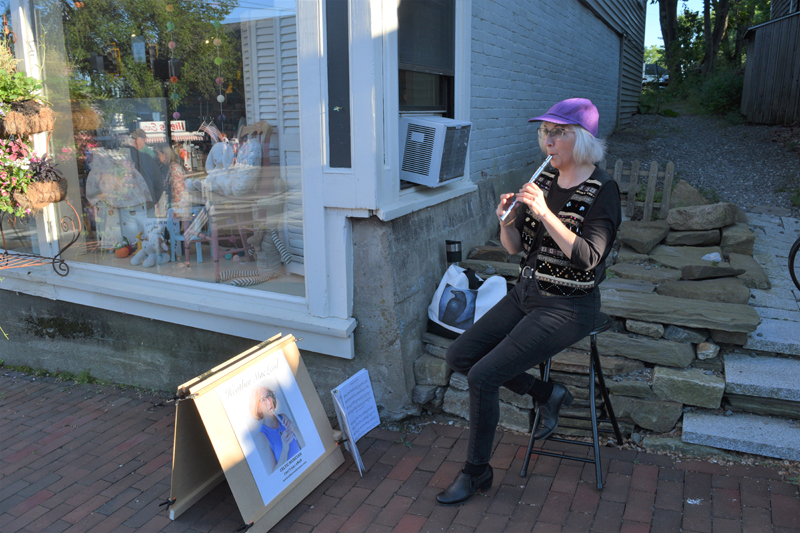 Musician Heather MacLeod plays the penny whistle outside of the pop-up Hasenfus Gallery at the Wiscasset Art Walk on June 24. (Nate Poole photo)