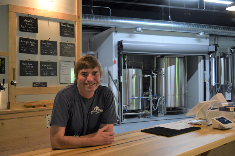 Bath Ale Works' primary owner and head brewer Pepper Powers at the bar in his taproom in the Wiscasset Marketplace on June 17. Powers opened the brewery in Wiscasset over Memorial Day weekend. (Nate Poole photo)