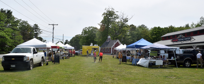 Vendors set up on the lawn in front of the Maine Tasting Center during the Wiscasset Farmers' Market on Wednesday, June 2. (Nate Poole photo)