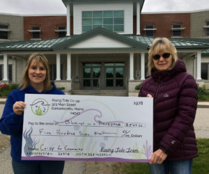 The Blessings in a Backpack program at Jefferson Village School receives a donation from Rising Tide Co-op in Damariscotta.