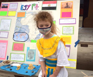 Damariscotta Montessori School student Lucia Sandrock waits to talk about her research about Egypt.