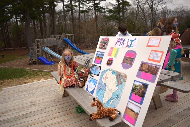 Damariscotta Montessori School student Josie Mess showcases her research about Mali during the school's annual Cultural Day.