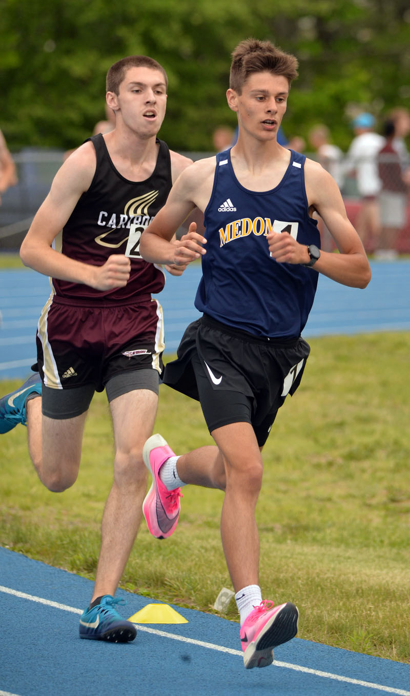 Medomak Valley runner Connor Daigle leads the field in the 3200-meter at the state Class B championship on Saturday, June 2. Daigle broke his own school record in the event in 9:42.61. (Paula Roberts photo)