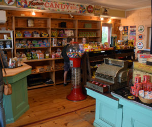 Customers shop in the newly renovated and reopened S. Fernald's Country Store in Damariscotta on Friday, June 25. The store is again open to walk-in traffic and offers novelty toys, nostalgic candies, pastries, and coffee from Rock City Coffee Roasters. (Evan Houk photo)