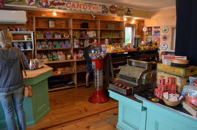 Customers shop in the newly renovated and reopened S. Fernald's Country Store in Damariscotta on Friday, June 25. The store is again open to walk-in traffic and offers novelty toys, nostalgic candies, pastries, and coffee from Rock City Coffee Roasters. (Evan Houk photo)