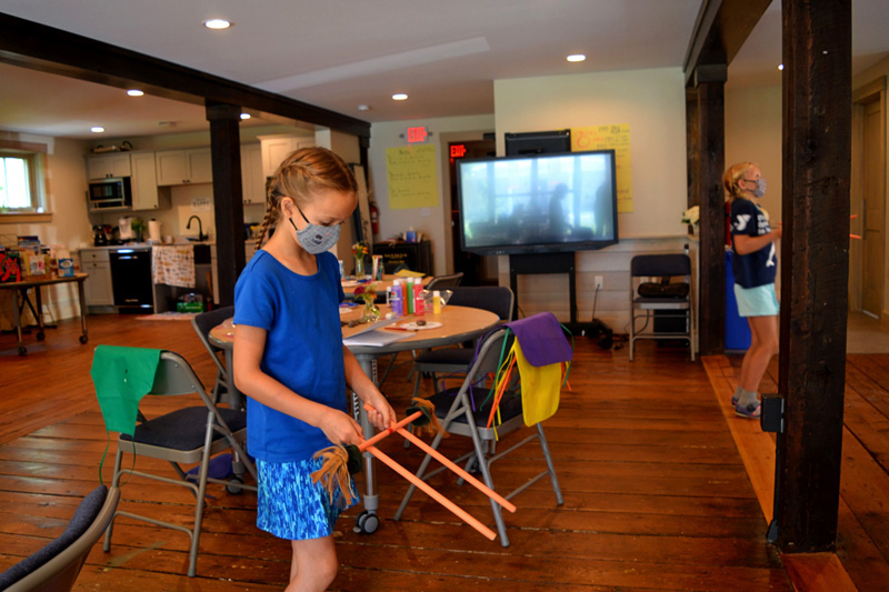 A camper practices with flower sticks inside the Merry Barn in Edgecomb on Friday, July 16. (Nettie Hoagland photo)