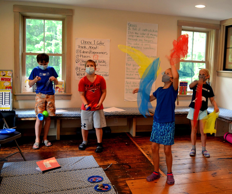 Campers juggle with scarves inside the Merry Barn during the Under the Big Top camp on Friday, July 16. (Nettie Hoagland photo)