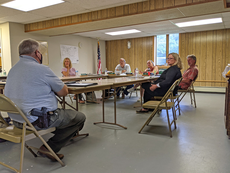 From left: Lincoln County Sheriff Todd Brackett discusses the excessive traffic on Route 27 and Eddy Road with recording secretary Barbara Brennan, Selectmen Ted Hugger and Dawn Murray, Rep. Holly Stover, and Selectman Mike Smith during the Edgecomb Board of Selectmen meeting on Monday, July 12. (Nate Poole photo)