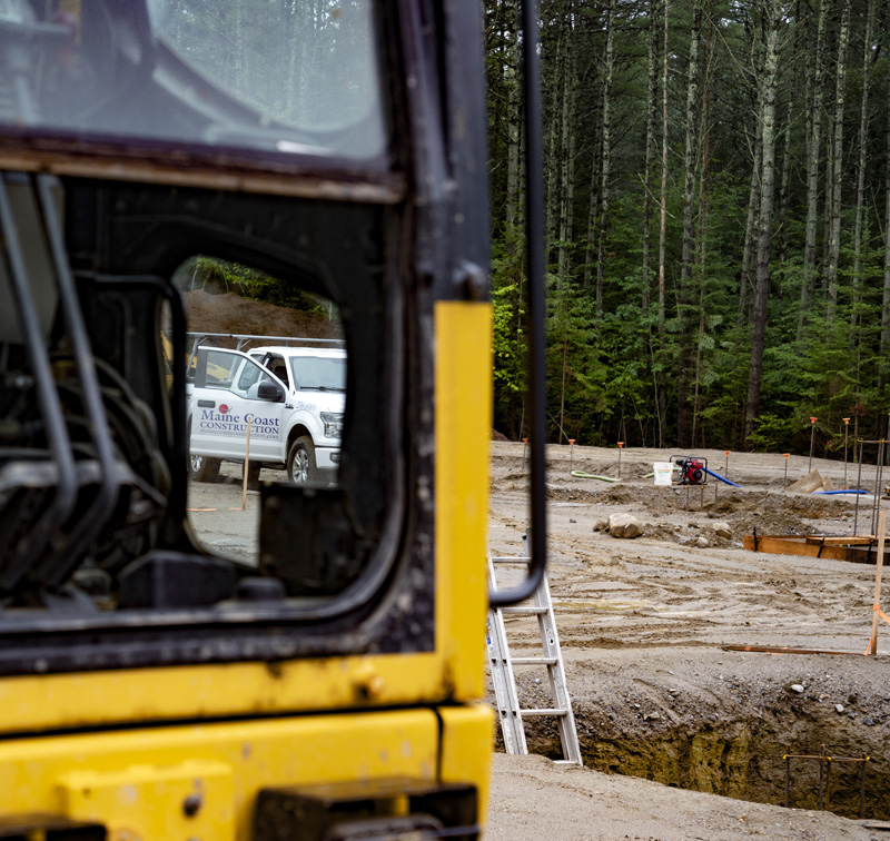 A Maine Coast construction truck is seen through the window of a construction vehicle in Waldoboro on July 19. The Camden company is the primary contractor for the construction of American Unagi's Waldoboro facility. (Bisi Cameron Yee photo)