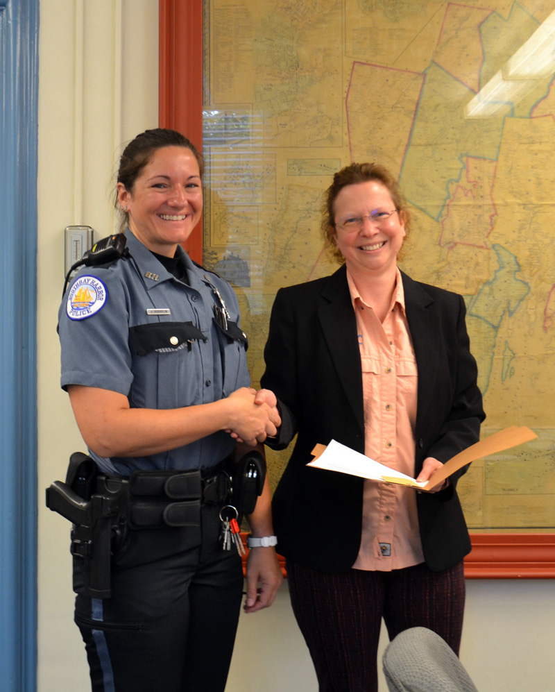 Communications Director Tara Doe presents the Maine EMS for Children Stork Award to Lincoln County Dispatcher Jennifer Gosselin during the Lincoln County Board of Commissioners meeting on Tuesday, July 20. (Charlotte Boynton photo)