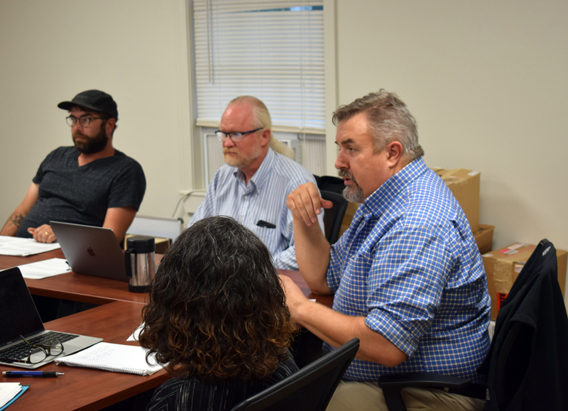 Newcastle town attorney Peter Drum (right) discusses liability concerns with the town and Newcastle's Taniscot Engine Co. with the selectmen and members of the fire company during a workshop on Wednesday, July 14. The Newcastle Board of Selectmen expressed a desire to better define the town's relationship with the fire company through an ordinance. (Evan Houk photo)