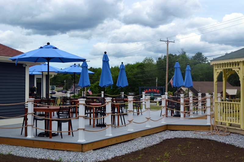 Visitors to the Maine Tasting Center can enjoy small plates and beverages at the outdoor seating area next to the tasting room. (Nettie Hoagland photo)