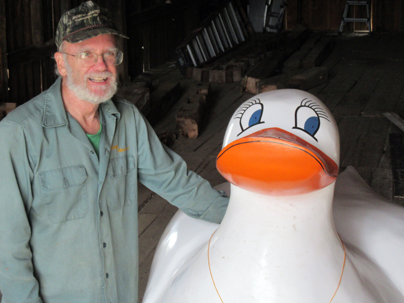 Pemaquacky, symbol of the Rubber Ducky Race, is welcomed to her new quarters by Phil Averill, race co-ordinator.