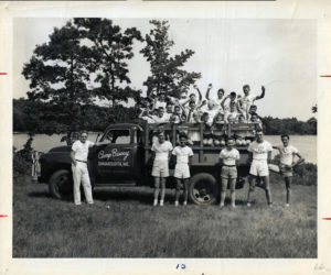 Camp Biscay Director Dick Bryant (L) standing alongside campers and counselors piled into the Camp Biscay truck. (Photo from Ivan Flye collection)