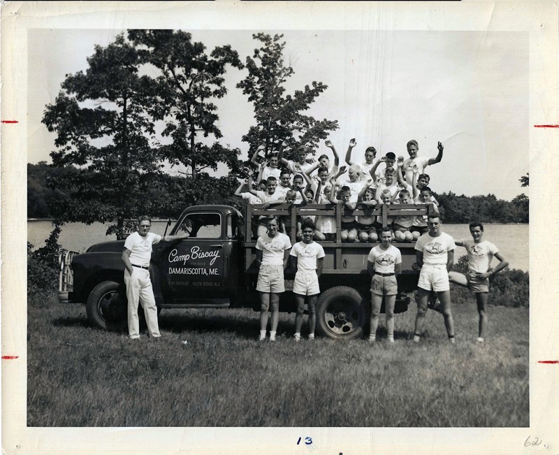 Camp Biscay Director Dick Bryant (L) standing alongside campers and counselors piled into the Camp Biscay truck. (Photo from Ivan Flye collection)