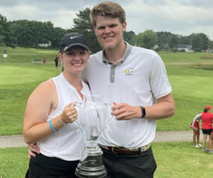 Bailey Plourde, of Newcastle, holds her Maine Women's Amateur trophy with her caddy and boyfriend Hans Stromberg. (Photo courtesy Lynne Plourde)
