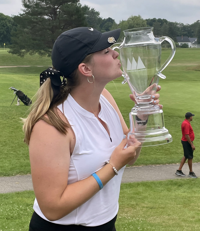 Bailey Plourde kisses her trophy after winning the Maine Women's Amateur Golf Tournament at Bangor Municpal Golf Course on July 21. (Photo courtesy Lynne Plourde)