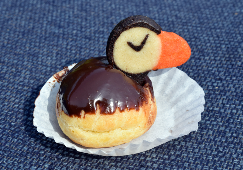 Susan Seabird Sue Schubel, of Project Puffin, presented a final surprise-- her famous Cream Puffin dessert-- to all of the estimated 75 attendees at a garden party dedicating the Steve Kress Native Plant Wildlife Garden at the Todd Wildlife Sanctuary in Bremen on Saturday, Aug. 7. (Evan Houk photo)