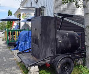 A food smoker sits in front of J & J Jamaican Grocery and Gift Shop at 88 Main Street in Damariscotta on Tuesday, Aug. 3. The town's Code Enforcement Officer issued a cease-and-desist letter for the smoker operations on Sunday, Aug. 1 after receiving complaints on Saturday, July 31. (Evan Houk photo)