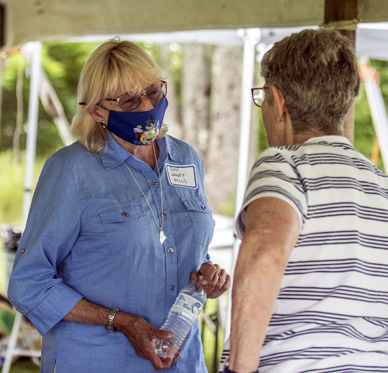 Gov. Janet Mills greets a constituent at the Lincoln County Democratic Committee’s 2021 Family Fun Day Lobster Bake in Waldoboro on Sunday, August 8. (Bisi Cameron Yee photo)