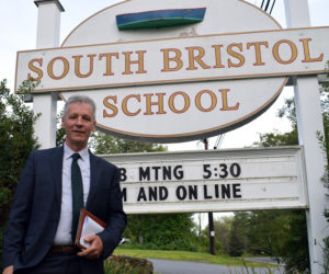 Charles "Chuck" Hamm stands outside of South Bristol School after being appointed principal at the South Bristol School Committee meeting on Tuesday, Aug. 3. Hamm previously worked as superintendent and head of school for Islesboro Central School for three years and he said he hopes to finish his career at SBS. (Evan Houk photo)