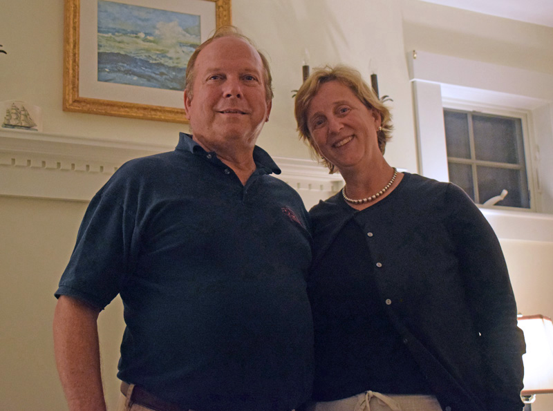 Owners of the Harbor View House in Round Pond, James "Jim" and Sarah Matel, stand inside the hearth of the common area during an open house on Sept. 26. (Evan Houk photo)