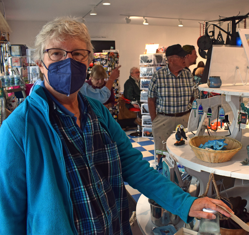 Karen Sunderhauf, who lives right down the road and has been visiting the Seagull Gift Shop and Restaurant at Pemaquid Point since she was four, talks about her memories of the iconic shop during the new building's grand opening on Thursday, Sept. 9, exactly one year after the old building burned down. (Evan Houk photo)