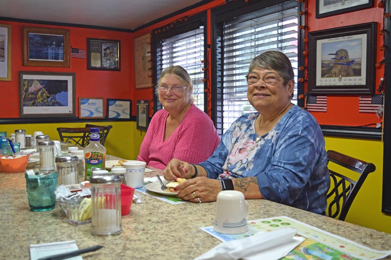 Theresa Williams (left) and Rose Dershaw are long-time customers and eat at the Hot Spot Diner together every Thursday. For breakfast they recommend the hash and bacon. (Nate Poole photo)