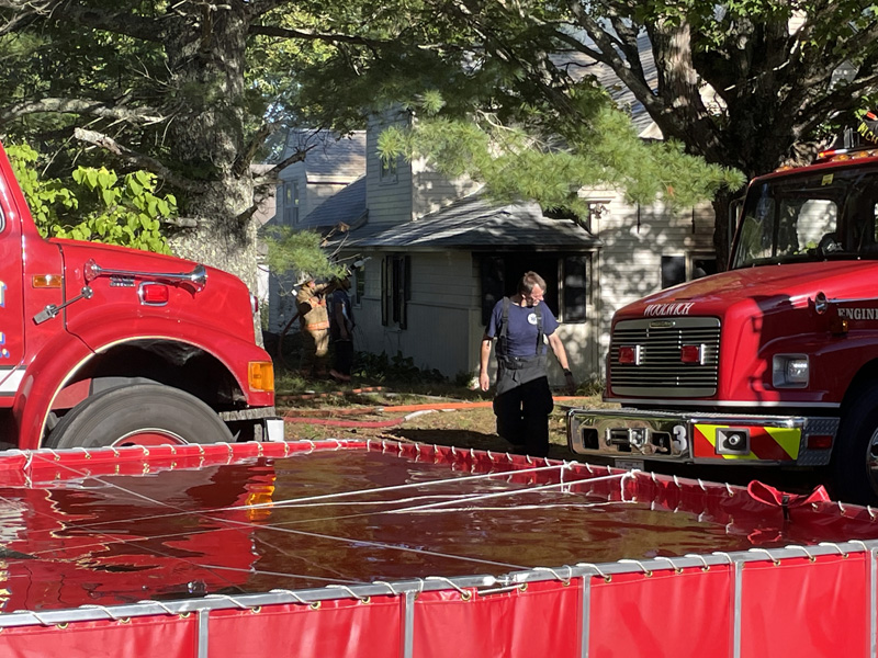 A portable water source was used to extinguish a fire at a home on Middle Road in Dresden on Sunday, Sept. 19. (Raye Leonard photo)