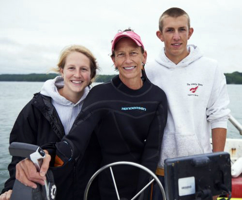 Morgan (left), Barb, and Bennett Scully on one of her boats on the Damariscotta River. Both of Barb Scully's children gained valuable experience working for her as crew managers at Glidden Point before moving on to their careers. (Photo courtesy Barb Scully)