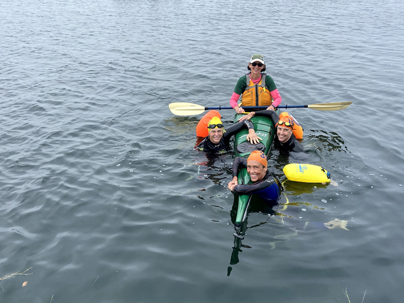 Clockwise from left: Meghan Phillips, KC Ford, Lili Pugh, and Lorna Fake on the day of their swim in Friendship Harbor on Aug. 22 as a part of Team Chewonki's Cross for LifeFlight's fundraiser. (Photo courtesy Lili Pugh)