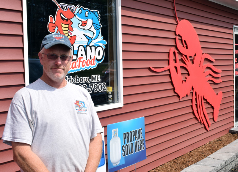 Kendall Delano Jr., co-owner of Delano Seafood Market in Waldoboro, stands outside of a newly constructed building that will house the market by October and offer twice as much retail space. Delano plans to hold a grand opening celebration and 20th anniversary bash for his business once the building is complete. (Evan Houk photo)