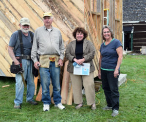 From left: Erik Ekholm, Dennis Merrill, Sue McKeen, and Cheryle Joslyn in front of the Whitefield Library and Community Center's in-progress storage shed on Sept. 28. (Nate Poole photo)