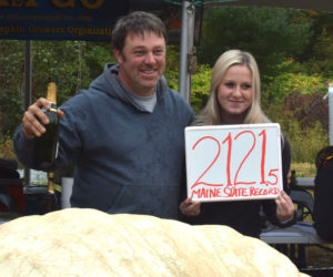 Edwin Pierpont stands with his daughter Paris Pierpont behind his 2,121.5-pound Maine state record giant pumpkin during the Damariscotta Pumpkinfest weigh off on Oct. 3. Paris Pierpont died in a single vehicle crash in Edgecomb on the evening of Oct. 10. (Evan Houk photo)