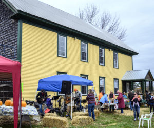 Residents celebrate the season at the Whitefield Library and Community Center Fall Festival in Whitefield on Oct. 23. People came early for music, food, kids activities, and a book sale, despite the chill in the air. (Bisi Cameron Yee photo)