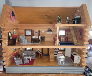 This coastal-themed log cabin dollhouse furnished by the Pemaquid Chapter of the Daughters of the American Revolution will be raffled in December to raise funds for Boothbay V.E.T.S. (Courtesy photo)