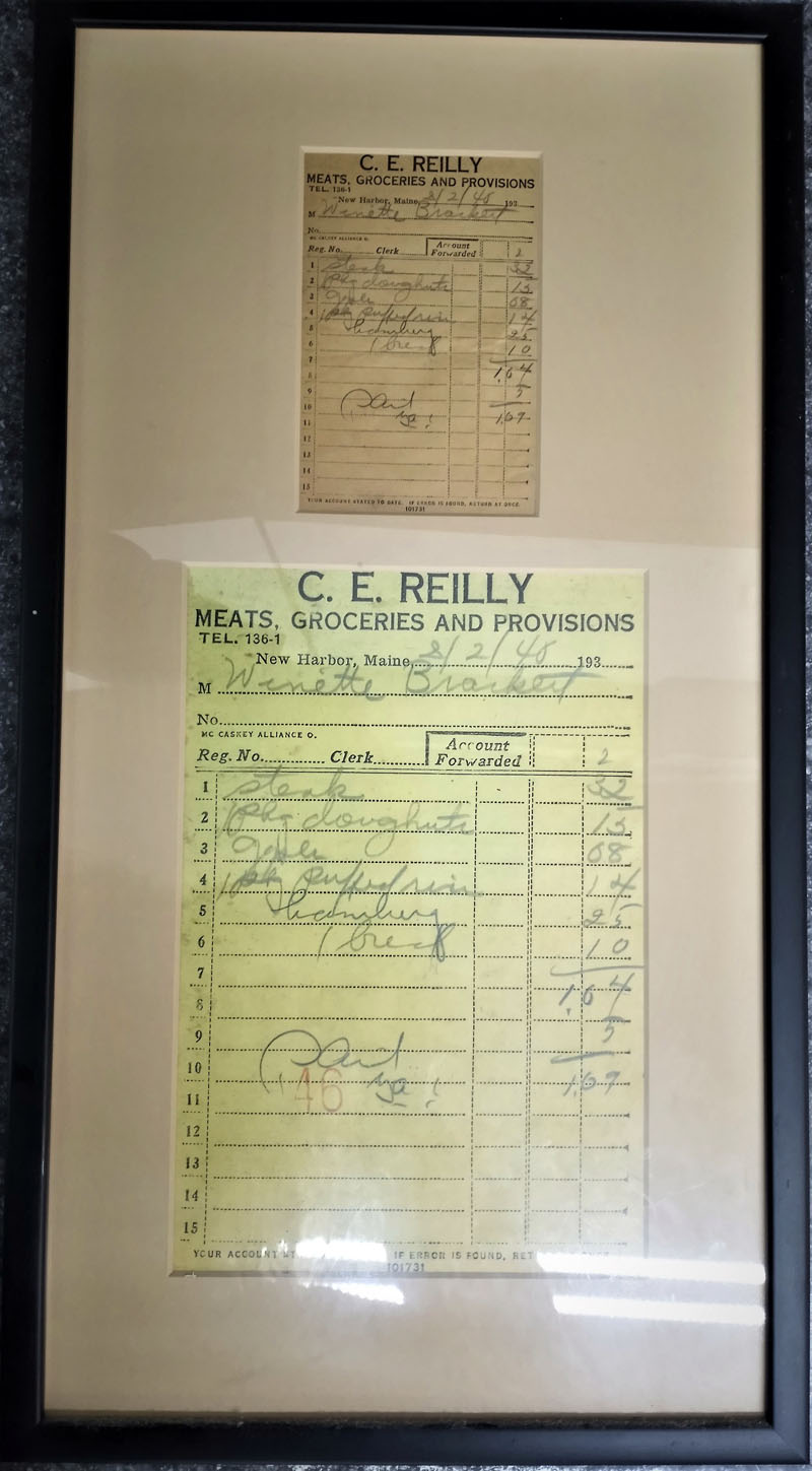 A framed receipt from C.E. Reilly & Son from Feb. 2, 1940, found in a nearby house. (Emily Hayes photo)