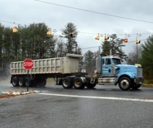 A tractor trailer traveling on U.S. Route 1 passes the intersection with Belvedere Road in Damariscotta, where the Department of Transportation intends to install a $3.1 million roundabout in 2024. (Nate Poole photo)