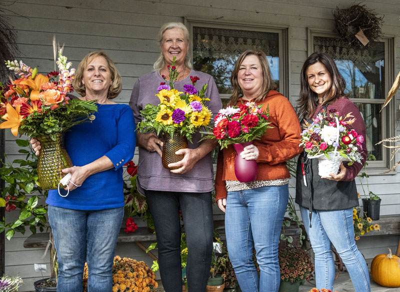 From left: Shelley Pease, Nadia Colvin, Leeanne Mank, and Lorielle Barter stand in front of Shelley's Flowers & Gifts in Waldoboro. "The real deal is everyone who works here," Pease said of her dedicated and talented staff. (Bisi Cameron Yee photo)