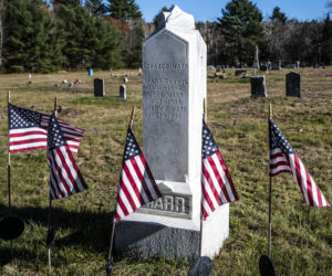 Flags indicating veteran graves surround the Marr family marker at the Sand Hill Cemetery in Somerville. The flags are placed on Memorial Day and grace the graves of those who served through Veteran's Day. (Bisi Cameron Yee photo)