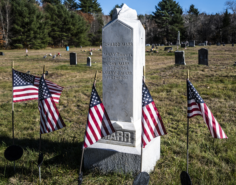 Flags indicating veteran graves surround the Marr family marker at the Sand Hill Cemetery in Somerville. The flags are placed on Memorial Day and grace the graves of those who served through Veteran's Day. (Bisi Cameron Yee photo)