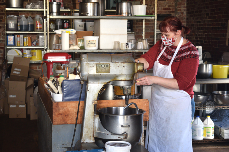 Kitchen Manager Heidi Eastman baking in the kitchen behind Treats' storefront in Wiscasset on Nov. 16. (Nate Poole photo)